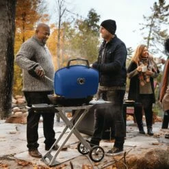 Napoleon TQ285X-BL-1 TravelQ 285 Portable Grill With Scissor Cart, Propane -KICKASS GRILLS Sales tq285x muskoka lifestyle people grilling bl 1